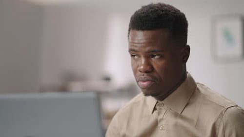 Young Man Talking on Laptop Video Call
