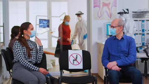 Patients Waiting in Socially Distanced Medical Waiting Room
