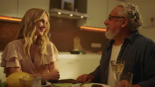 Affectionate Couple Sharing Meal and Holding Hands