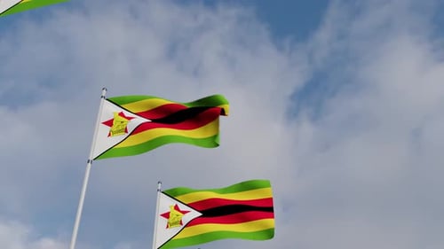 Waving Zimbabwe Flags Against a Blue Sky with Clouds