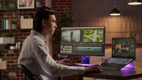 Asian Freelancer Working with Movie Content on Editing Software