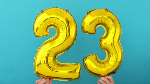 Gold Number Balloons Celebrating Twenty-Three Years