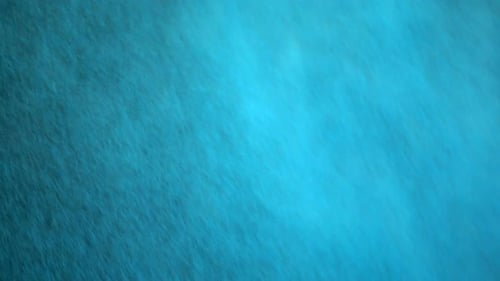 Abstract Colorful Powder Expanding Across the Screen