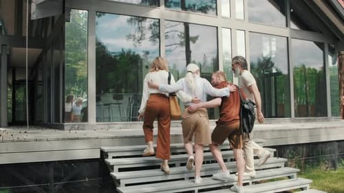 Friends Arriving at Modern House in Nature