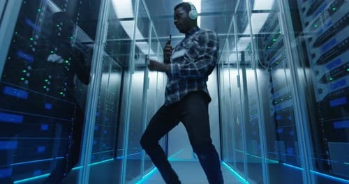 Young Man Dancing in Data Center Server Room