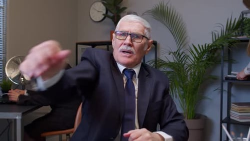 Upset Business Man Loudly Yells Waving Hands From Rage at Office Workplace Screaming Angry Furious