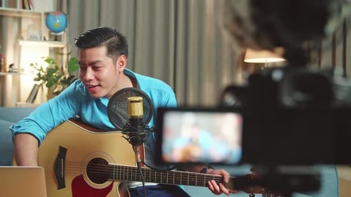 Man Plays Guitar and Records Himself