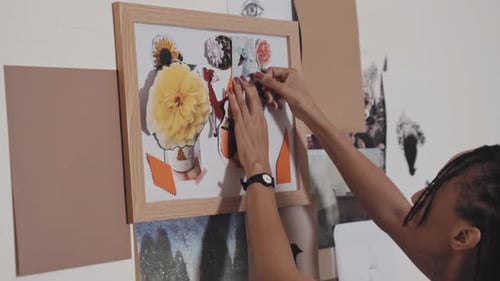 Woman Decorating Art Collage Board at Home