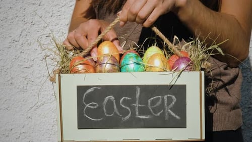 Decorated Easter Eggs Arranged in a Basket