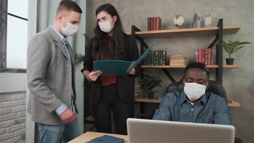 Small Creative Group Business People Have a Meeting and Working in the Office and Wear Masks. Work