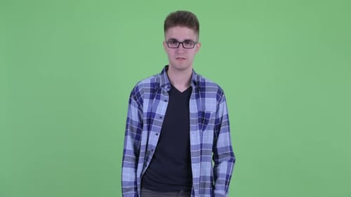 Young Man Wearing Glasses Expressing Frustration