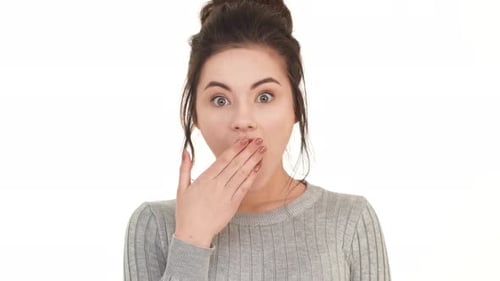 Surprised Woman Covering Mouth with Hand