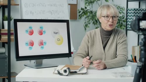 Mature Woman Teaching Science in Online Classroom
