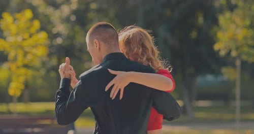 Loving Couple Dancing Together in Urban Park