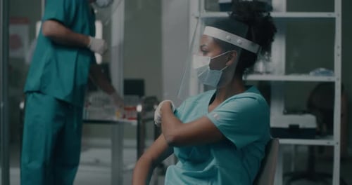 Diverse Doctors During Vaccination in Hospital