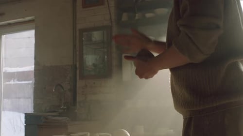 Woman Potter Is Shaping Piece of Raw Clay