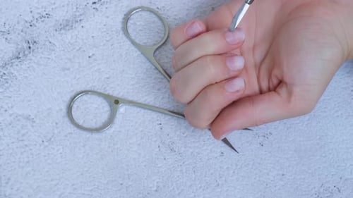 Adult Performing Cuticle Care Close Up