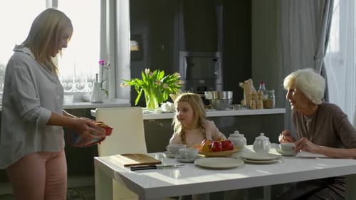 Mother Serving Pie for Family Dinner
