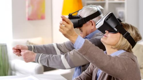 Senior Couple Enjoys Virtual Reality in Living Room