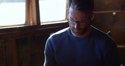 Man writing on a diary at home