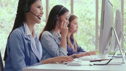 Customer Support Agent or Call Center with Headset Talking to Customer on Phone