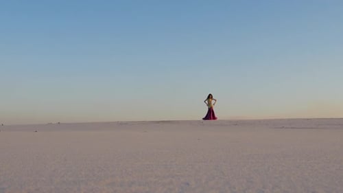 Woman Posing Gracefully in Desert Landscape