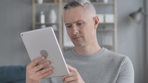 Adult Using Tablet Indoors Close Up