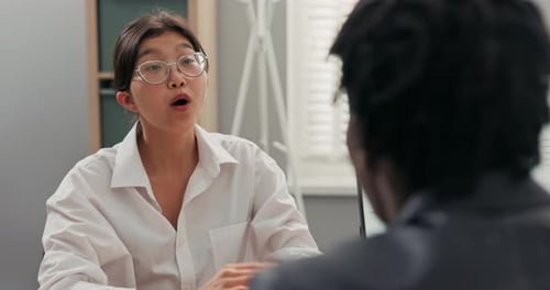 Head of Company Darkskinned in Suit Talks to Candidate for Position of Office Secretary Girl with