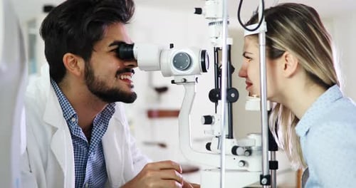 Doctor Examines Patient Using Eye Exam Machine