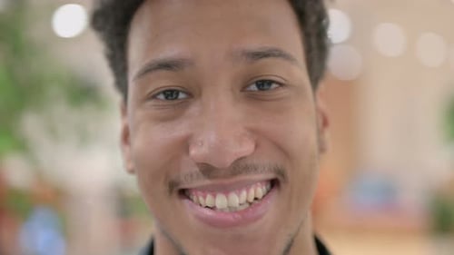 Close Up of Face of African American Man Smiling at the Camera