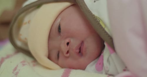 Close-up of a Peaceful Fair-skinned Infant Sleeping