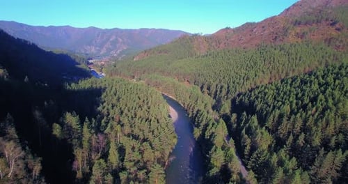 Low Altitude Flight Over Fresh Fast Mountain River with Rocks at Sunny Summer Morning.