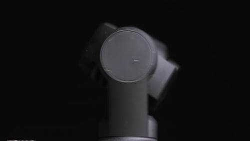 Camera Gimbal Rotating on Black Background
