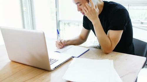 Young Adult Works and Talks on Phone