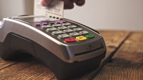 Credit Card Payment Terminal, Swiping for Sale Transaction. Close-up View.