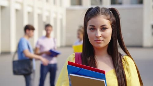 Portrait of Student Posing Near College Building