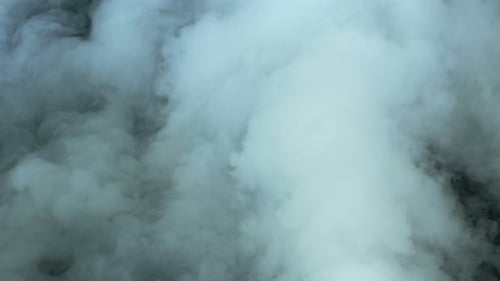 Gentle Wisps of Drifting Grey Smoke and Fog