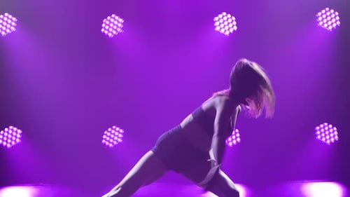 Woman Dancing with Purple Lights Background