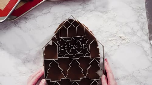 Flat lay. Step by step. Cutting out shapes with Christmas cookies cutter from gingerbread cookie dou