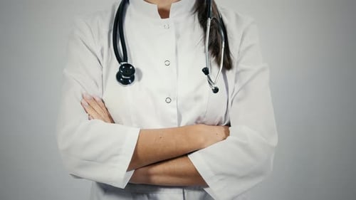 Medical Professional Puts on Stethoscope