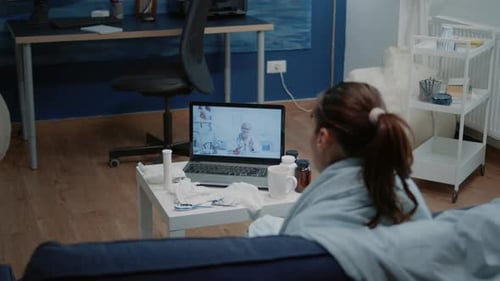 Woman Uses Telehealth Service From Home