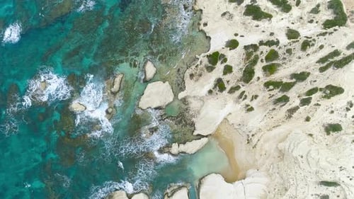 Ocean Waves Splash Against Rocks Background Cliffs in the Sea Top Aerial View of Cyprus