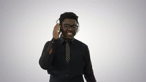 Man with Headphones Adjusting Earpiece