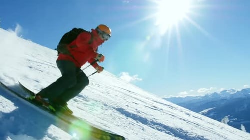 Person snowboarding on snowy mountain