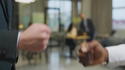 Diverse Business Colleagues Fist Bump in Office