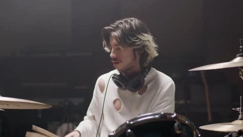 Drummer in Trendy Shirt Playing Drums at Music Studio