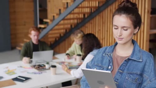 Young Businesswoman Using Tablet in Office