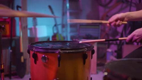 Unrecognizable Man Playing Wet Drum