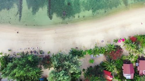 Paradise exotic beach with white sand washed by colorful lagoon with coral reefs on tropical island