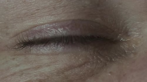 Macro Close Up View of Male Open Eye From Man Half Face